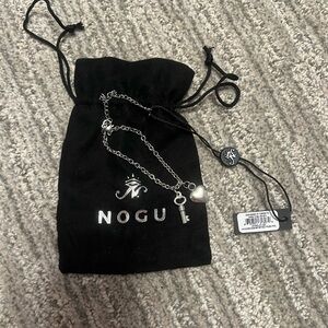 NOGU.  Sterling Silver Adjustable Heart and Key Bracelet.